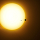Artist’s impression of the exoplanet Kepler-1625b transiting the star with the candidate exomoon in tow.